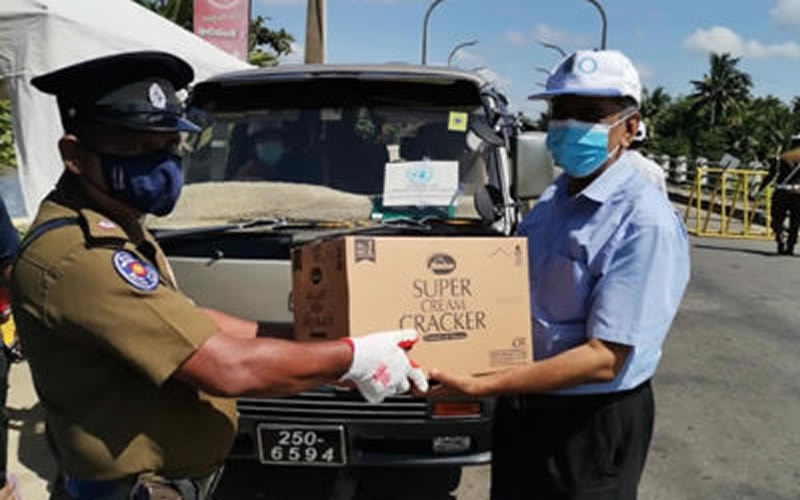 Distribution of Water Bottles and Biscuits to Police and Armed Forces Check